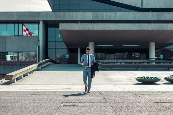 Man In Suit Walking Away From Office