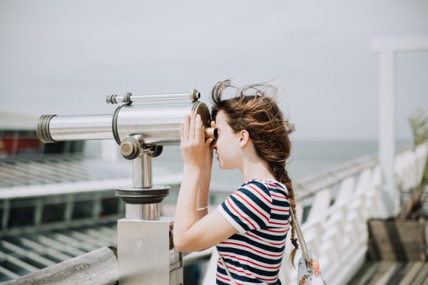 Girl Looking Through Spyglass