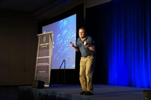 Man Presenting on Stage