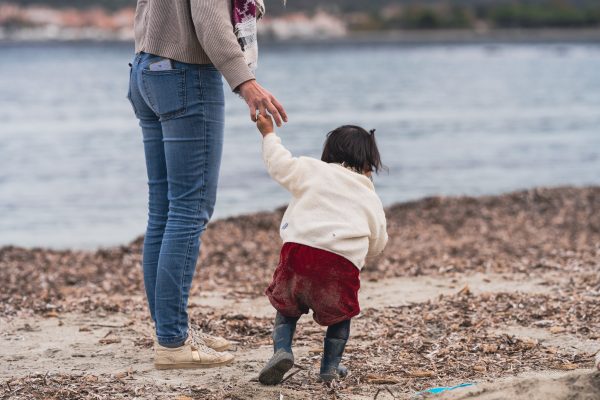 Woman Leading Child