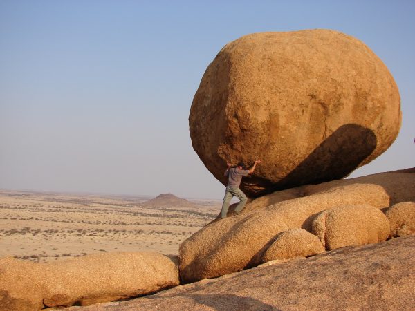 Man Pushing Rock