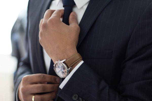 Man Straightening Tie