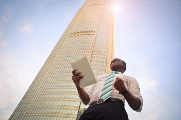 Presenting In Front Of Skyscraper