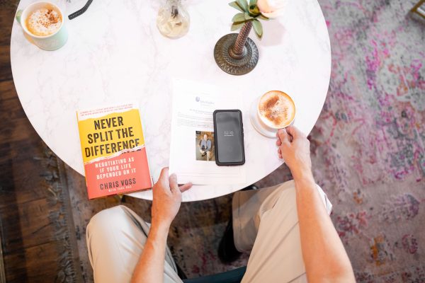 At a coffee shop with a book