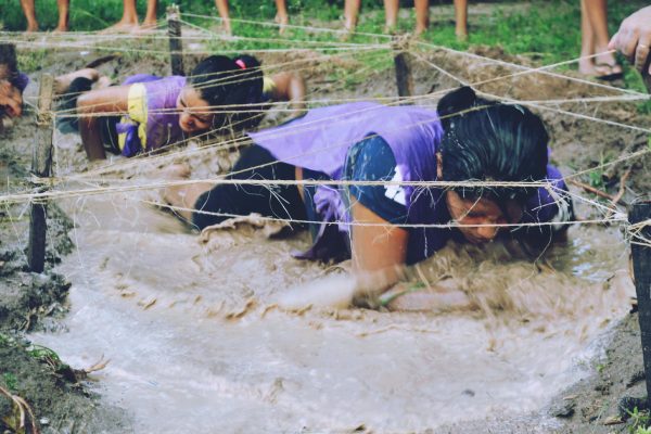 Women navigating obstacle course
