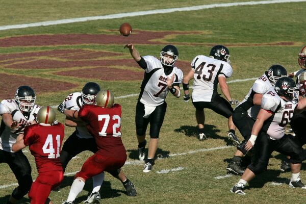 Quarterback making pass